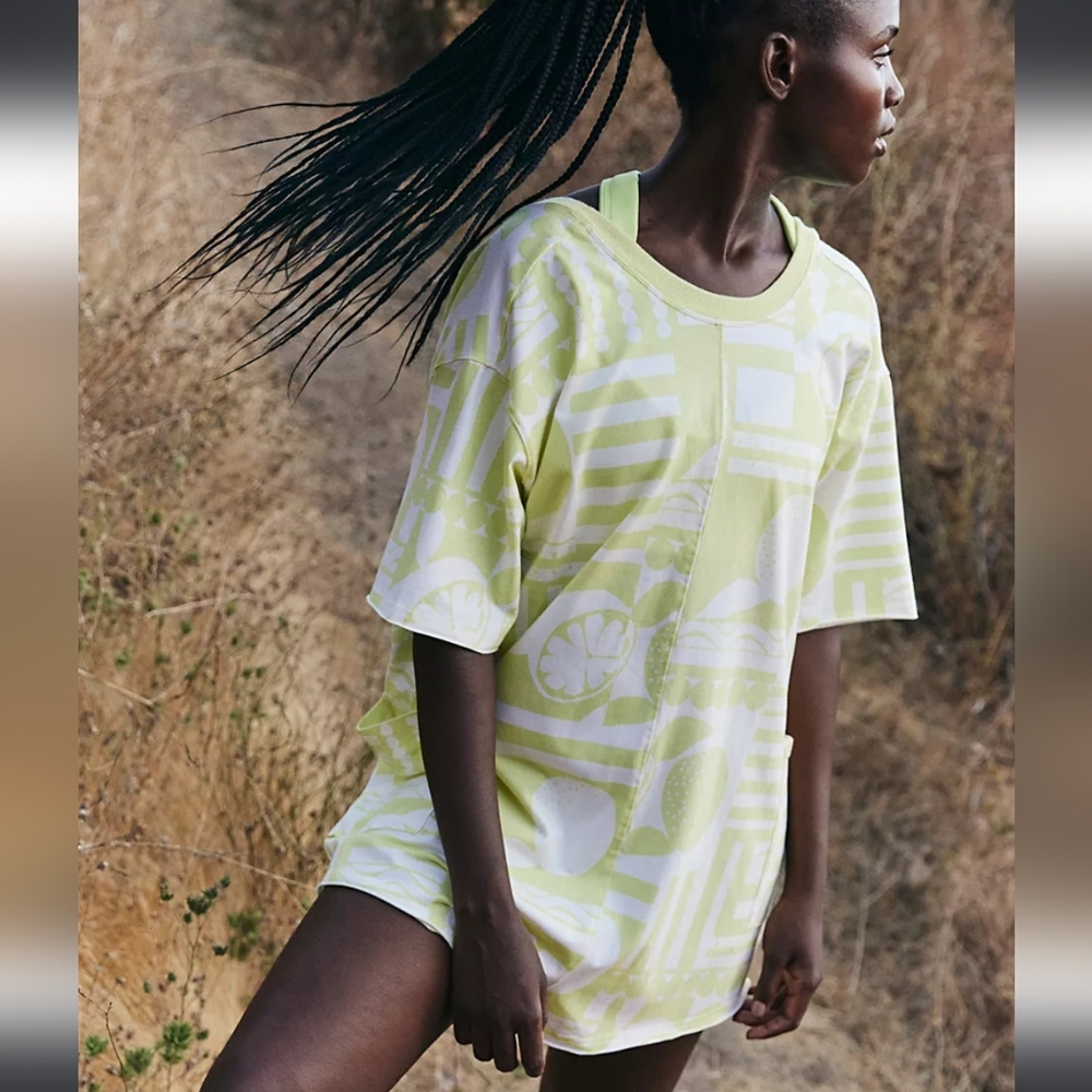 FP Movement by Free People Hot Shot Printed Tee Romper in Sunday Market Zest